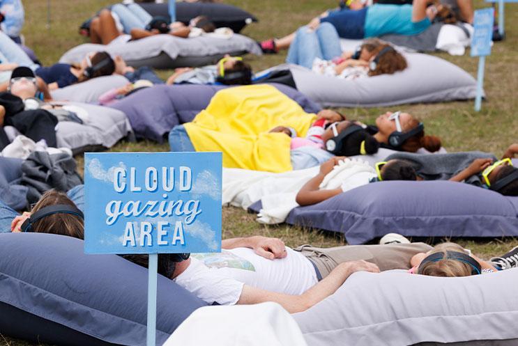 People relaxing on giant beanbags