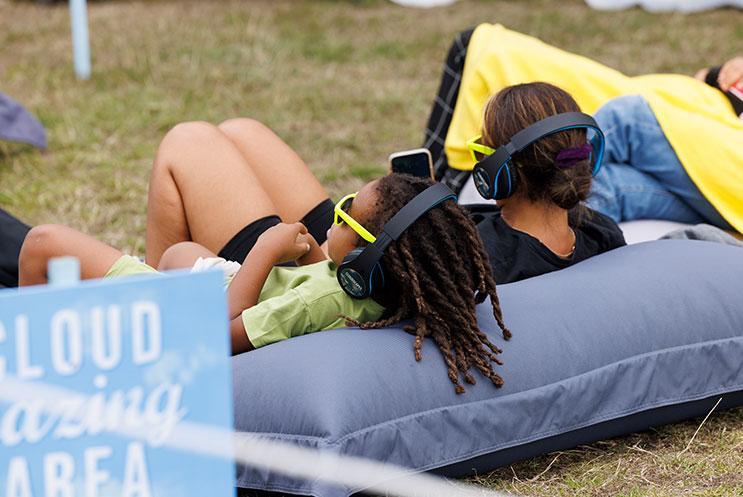 People relaxing on giant beanbags